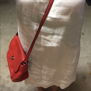 Red over-the-shoulder coach purse